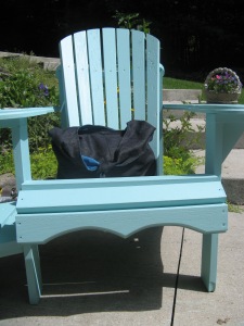 Sparkle denim hobo bag on blue chair